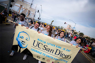 https://www.bridginglivesmag.com/wp-content/uploads/2025/03/mlk-parade-2020.jpg