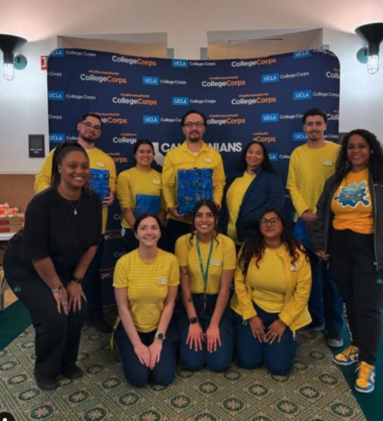 Nine members of UCLA College Corps pose at a fire-relief care package event.