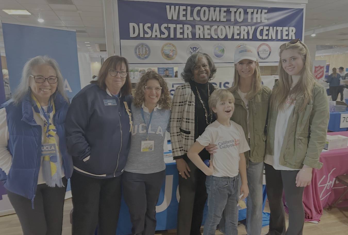 At the disaster recovery center (left to right): UCLA alumna volunteer Sally Lew; Julie Sina, UCLA associate vice chancellor for alumni affairs; Jennifer Poulakidas, UCLA associate vice chancellor for government and community relations; Yolanda Gorman, senior advisor to the UCLA chancellor and chief of staff; and California’s first partner Jennifer Siebel Newsom (with hat) and her children.